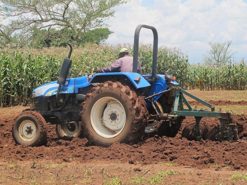 tractor tilling a land